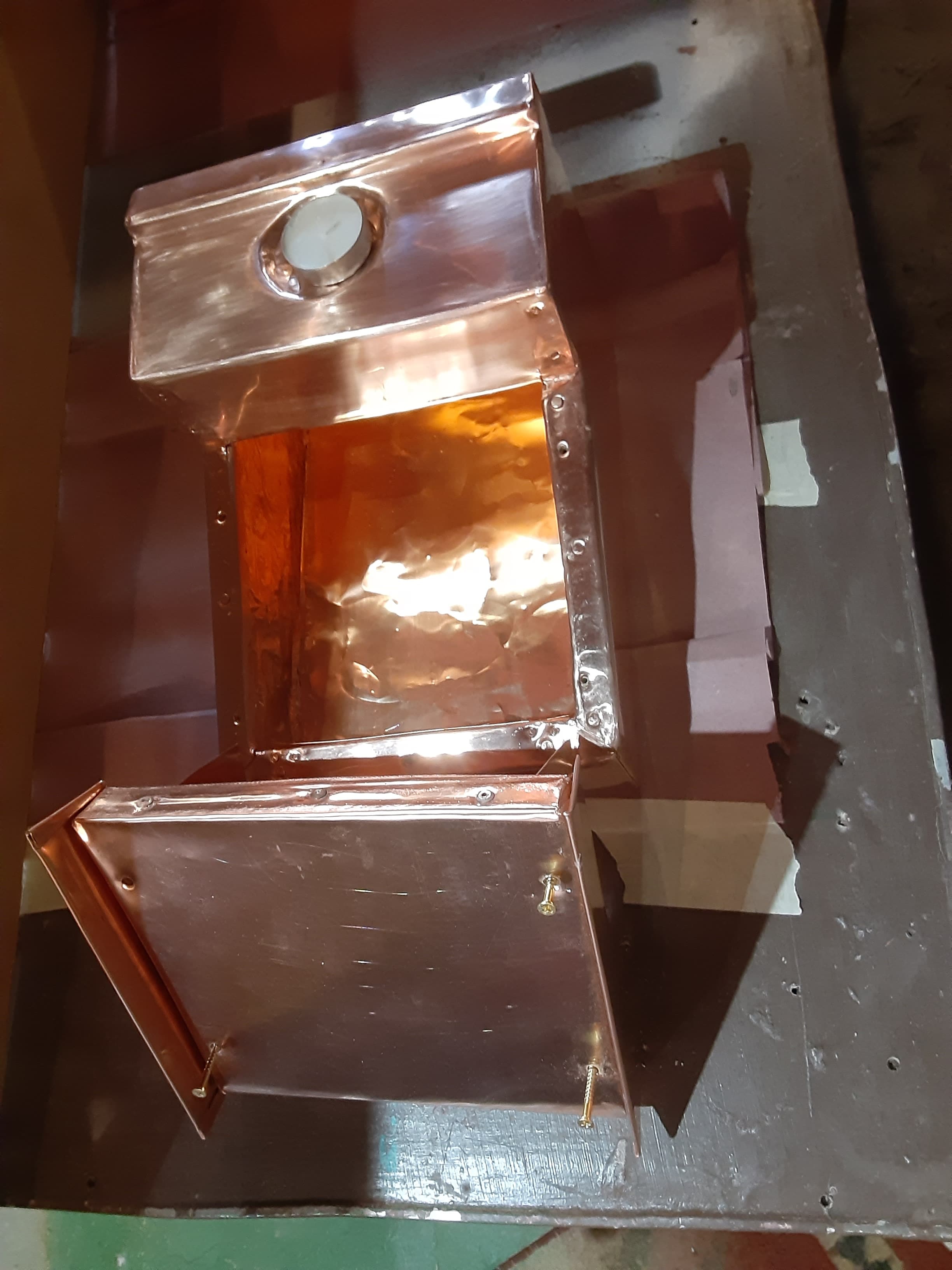 Copper urn made to look like an old school desk