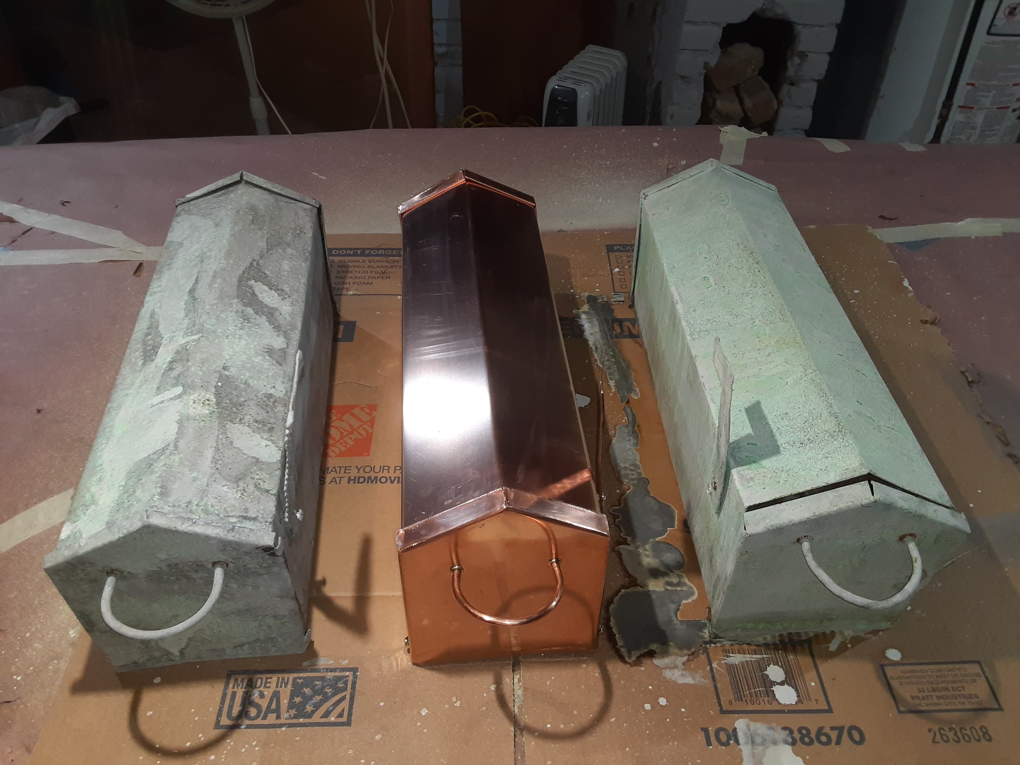 Three stages of copper aging on mailboxes