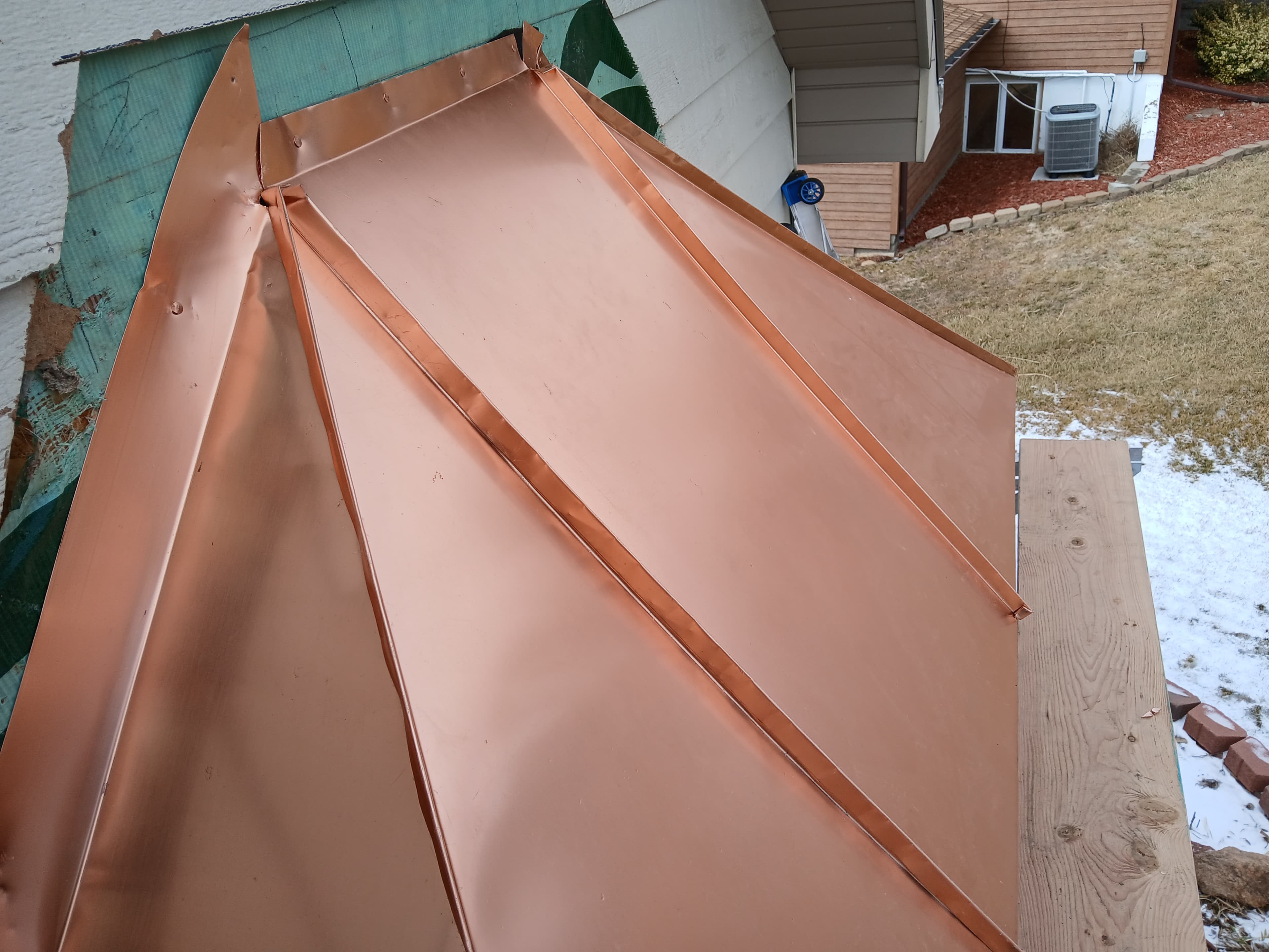 Copper standing seam awning rebuilt from the wall out